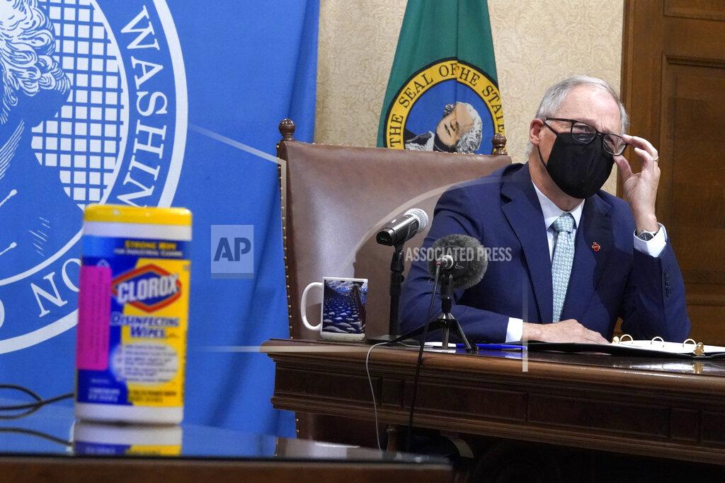 Ted S. Warren Washington Gov. Jay Inslee listens to a question during a news conference, Tuesday, Jan. 5, 2021, at the Capitol in Olympia, Wash. Inslee said some COVID-19 restrictions in Washington will be eased beginning next week and the state will change its reopening plan to move from a county-based oversight system to one focused on regions. (AP Photo/Ted S. Warren)
