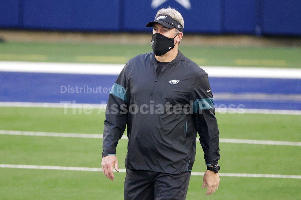 Philadelphia Eagles head coach Doug Pederson watches warmups before an NFL football game against the Dallas Cowboys in Arlington, Texas, Sunday, Dec. 27. 2020. (AP Photo/Michael Ainsworth)
