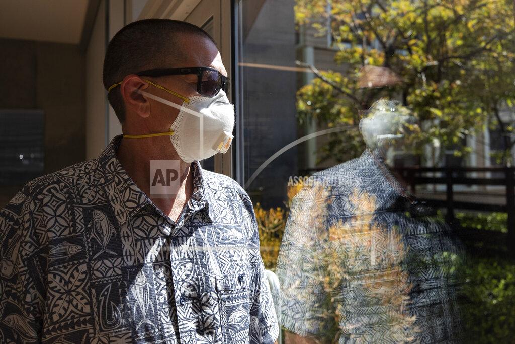Gregory Bull Gregory Arnold, a former guard at the Otay Mesa Detention Center, poses for a picture Tuesday, May 12, 2020, in San Diego. The early absence of facial coverings, lack of cleaning supplies and mixing symptomatic detainees with others preceded the first big outbreak at U.S. Immigration and Customs Enforcement's 221 detention centers. While the point of origin is unclear, accounts of how the virus spread at the Otay Mesa Detention Center expose shortcomings and inherent difficulties of managing the world's largest immigration detention system during a pandemic. (AP Photo/Gregory Bull)