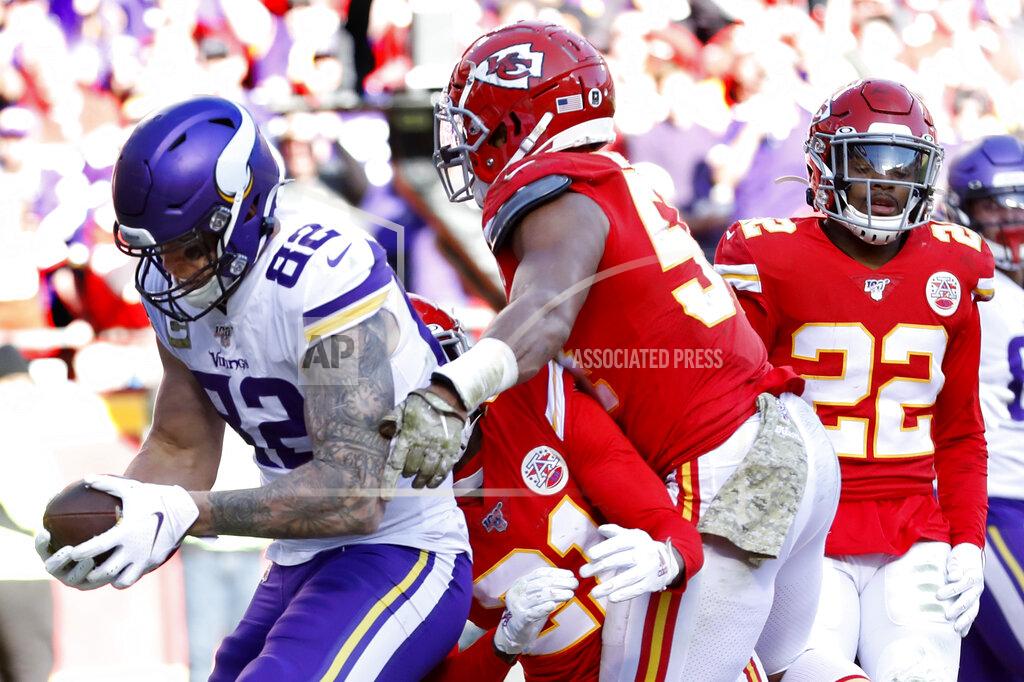 Colin E. Braley Minnesota Vikings tight end Kyle Rudolph (82) makes a touchdown catch against Kansas City Chiefs cornerback Bashaud Breeland (21), safety Juan Thornhill (22) and linebacker Damien Wilson (54) during the second half of an NFL football game in Kansas City, Mo., Sunday, Nov. 3, 2019. (AP Photo/Colin E. Braley)