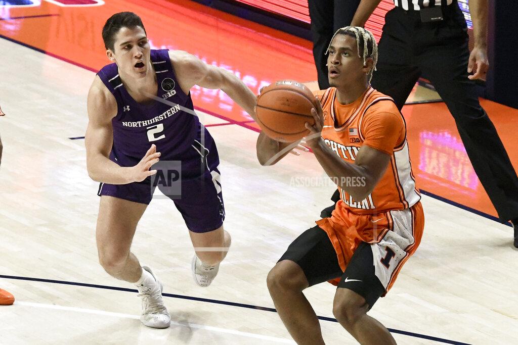 Holly Hart Illinois guard Adam Miller shoots as Northwestern's guard Ryan Greer (2) attempts to block in the first half of an NCAA college basketball game Tuesday, Feb. 16, 2021, in Champaign, Ill. (AP Photo/Holly Hart)