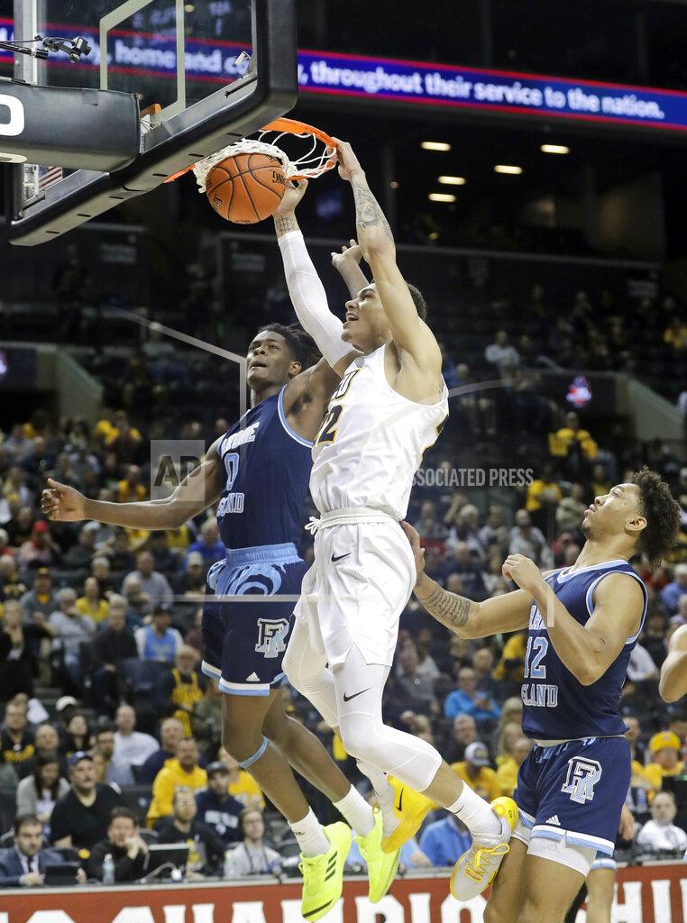 Frank Franklin Ii VCU's Michael Gilmore (22) dunks the ball in front of Rhode Island's Jermaine Harris (0) and Dana Tate (12) during the first half of an NCAA college basketball game in the Atlantic 10 conference tournament Friday, March 15, 2019, in New York. (AP Photo/Frank Franklin II)