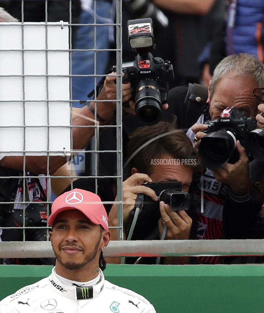 Luca Bruno Second placed Mercedes driver Lewis Hamilton of Britain smiles after the qualifying session at the Silverstone racetrack, in Silverstone, England, Saturday, July 13, 2019. The British Formula One Grand Prix will be held on Sunday. (AP Photo/Luca Bruno)