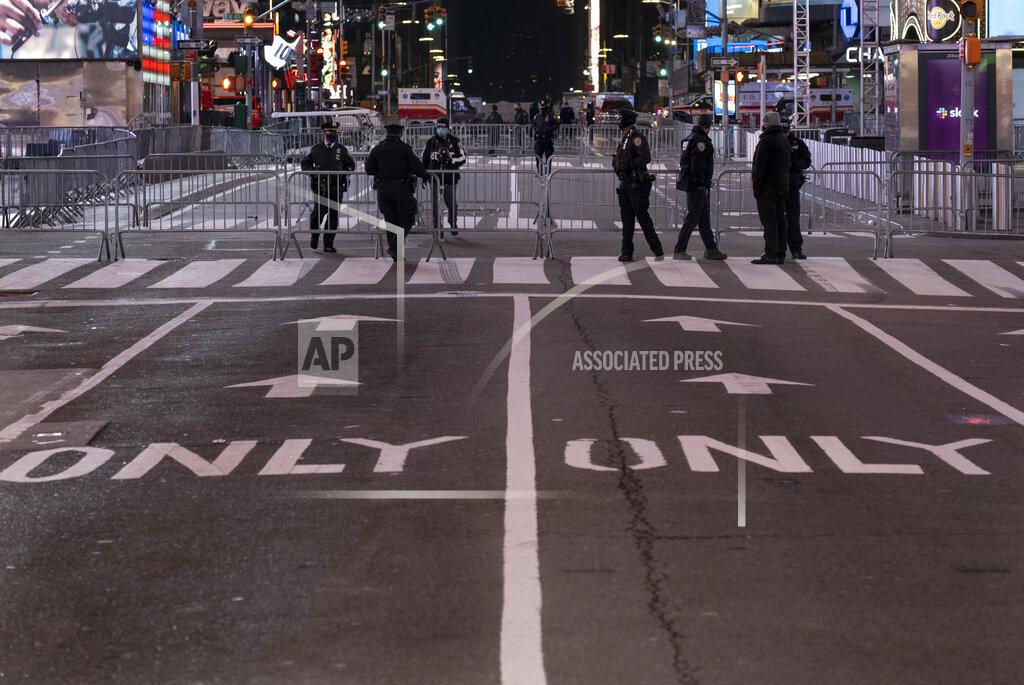 Craig Ruttle Seventh Avenue is mostly empty during what would normally be a Times Square packed with people in New York, late Thursday, Dec. 31, 2020, as celebrations have been truncated this New Year's Eve due to the ongoing pandemic. (AP Photo/Craig Ruttle)