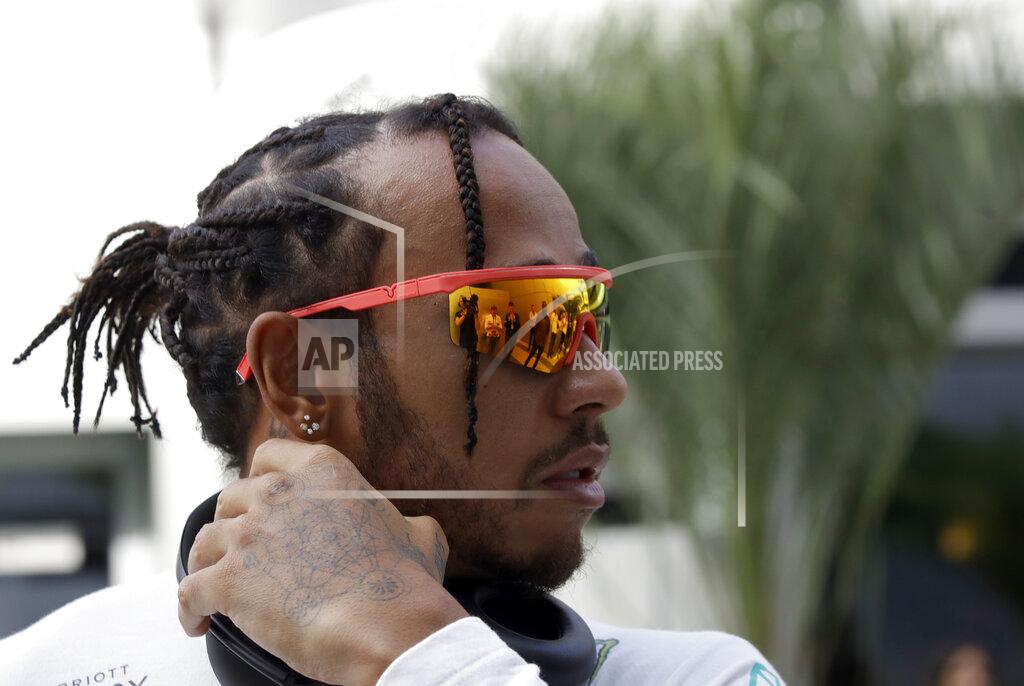 Luca Bruno Mercedes driver Lewis Hamilton of Britain walks through the paddock prior to the start of the first free practice at the 'Sochi Autodrom' Formula One circuit, in Sochi, Russia, Friday, Sept. 27, 2019. The Formula one race will be held on Sunday. (AP Photo/Luca Bruno)