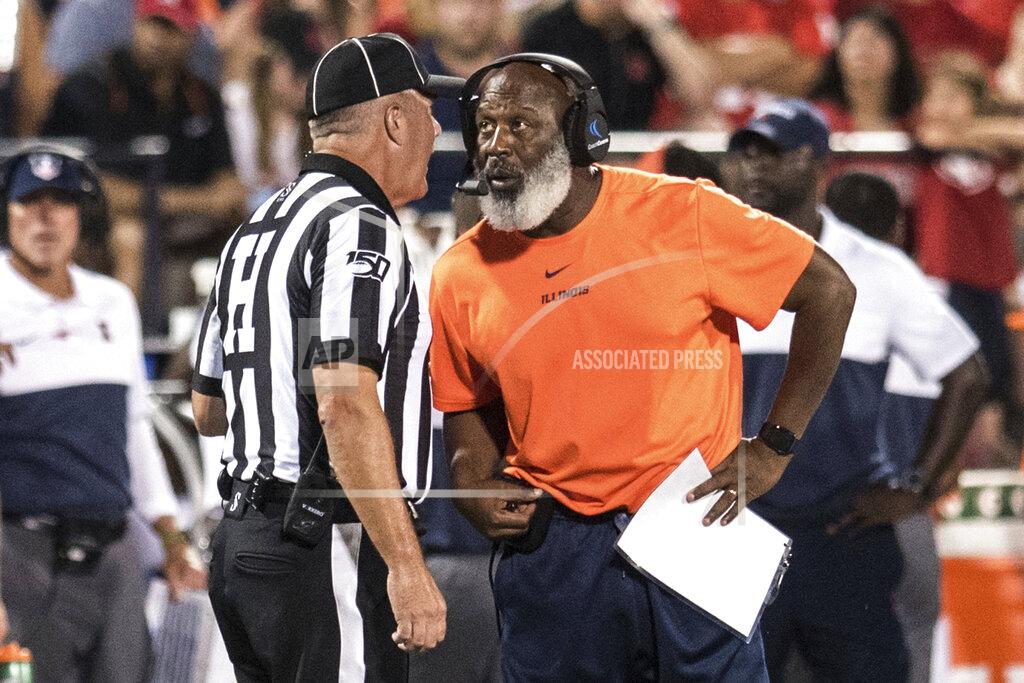 Holly Hart Illinois head coach Lovie Smith speaks with an official during a timeout in the first half of an NCAA college football game against Nebraska, Saturday, Sept. 21, 2019, in Champaign, Ill. (AP Photo/Holly Hart)