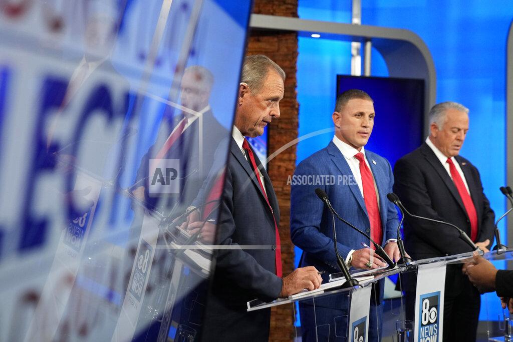 John Locher From left, North Las Vegas Mayor John Lee, Joey Gilbert, and Clark County Sheriff Joe Lombardo, stand before a Republican primary debate for Nevada governor Wednesday, May 25, 2022, in Las Vegas. (AP Photo/John Locher, Pool)