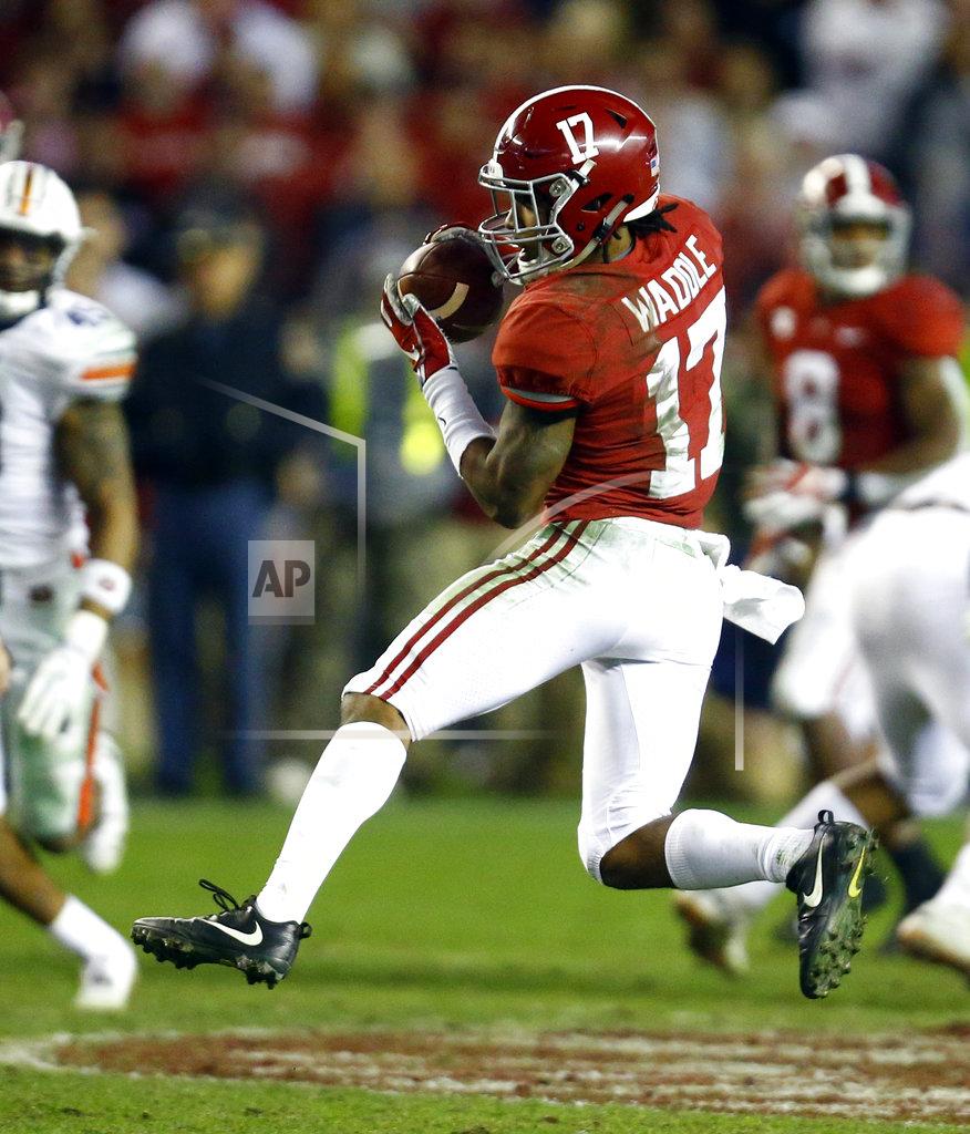 Butch Dill Alabama wide receiver Jaylen Waddle (17) catches a pass and thens carries it in for a touchdown against Auburn during the second half of an NCAA college football game Saturday, Nov. 24, 2018, in Tuscaloosa, Ala. Alabama won 52-21. (AP Photo/Butch Dill)