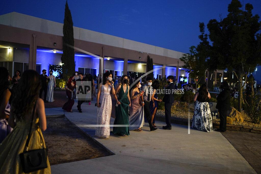 Paul Ratje Young people attend prom at the Grace Gardens Event Center in El Paso, Texas on Friday, May 7, 2021. Around 2,000 attended the outdoor event at the private venue after local school districts announced they would not host proms this year. Tickets cost $45. (AP Photo/Paul Ratje)
