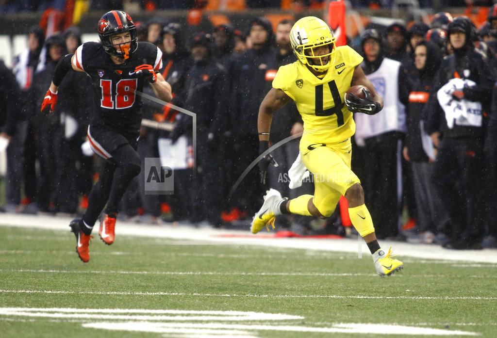 Timothy J. Gonzalez Oregon cornerback Thomas Graham Jr. (4) pulls away from Oregon State wide receiver Timmy Hernandez (18) on an interception return for a touchdown during the second half of an NCAA college football game in Corvallis, Ore., Friday, Nov. 23, 2018. Oregon won 55-15. (AP Photo/Timothy J. Gonzalez)