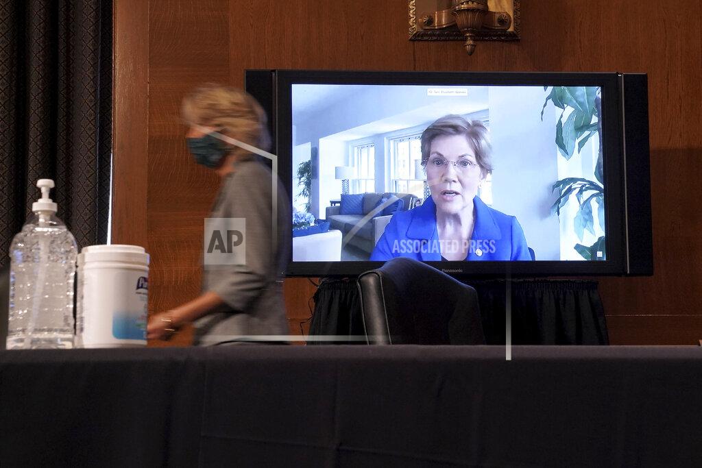 Greg Nash Sen. Elizabeth Warren, D-Mass., remotely questions Surgeon General Jerome Adams and Dr. Francis Collins, Director of the National Institutes of Health, during a Senate Health, Education, Labor and Pensions Committee hearing to discuss vaccines and protecting public health during the coronavirus pandemic on Capitol Hill, Wednesday, Sept. 9, 2020, in Washington. (Greg Nash/Pool via AP)