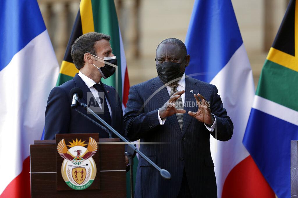 Themba Hadebe South African President Cyril Ramaphosa, right, and his French counterpart Emmanuel Macron attend a press conference at the government's Union Building, in Pretoria, South Africa, Friday, May 28, 2021. Macron is on a two-day official visit to the country. (AP Photo/Themba Hadebe, Pool)