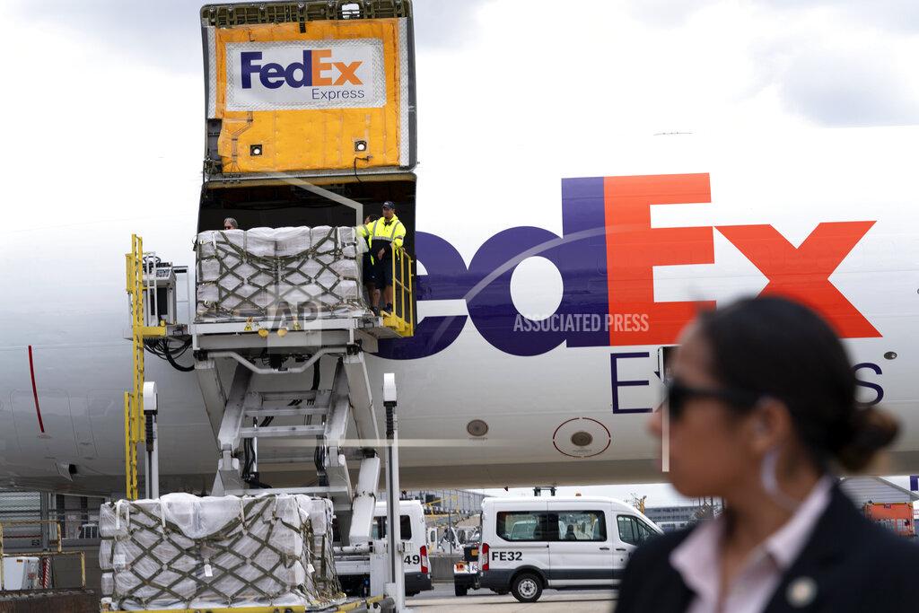 Jose Luis Magana Workers unload a Fedex Express cargo plane carrying 100,000 pounds of baby formula at Washington Dulles International Airport, in Chantilly, Va., on Wednesday, May 25, 2022. (AP Photo/Jose Luis Magana)