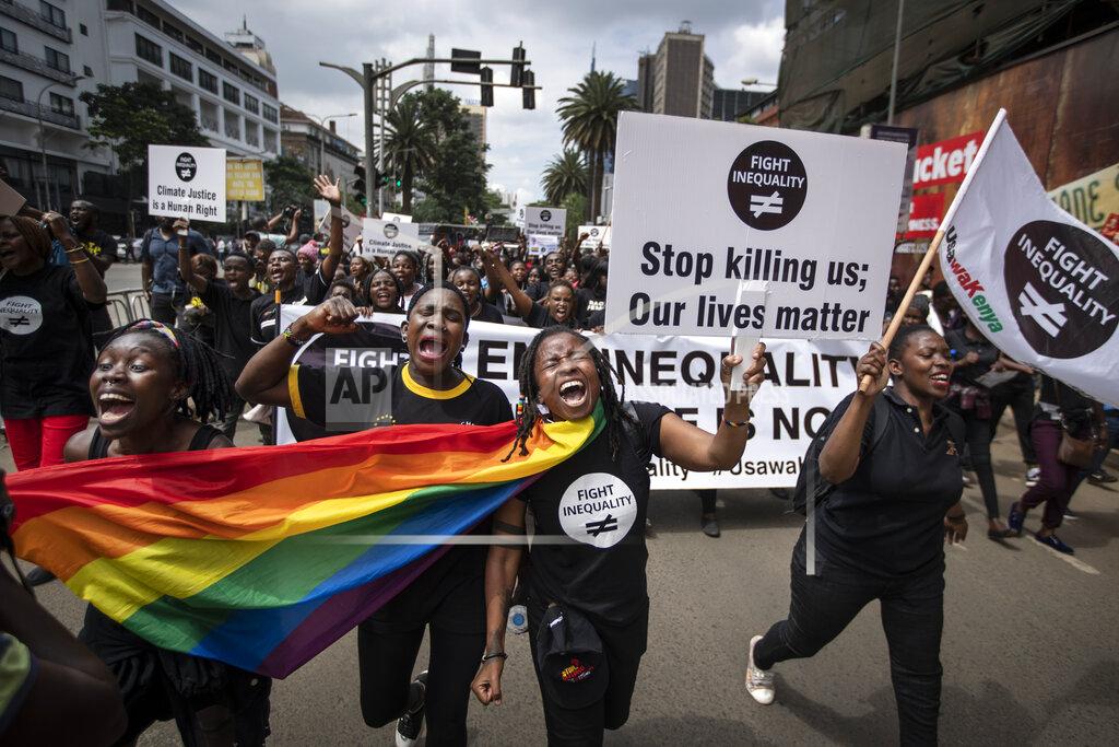 Ben Curtis FILE - In this Friday, Jan. 17, 2020 file photo, demonstrators calling for an end to the "age of greed" and demanding fairer solutions to inequality, climate change, debt, taxation and other economic and human rights issues ahead of the World Economic Forum, march to the office of the president in downtown Nairobi, Kenya. African leaders in 2020 are asking what China can do for them as the coronavirus pandemic threatens to destroy economies across a continent where Beijing is both the top trading partner and top lender. (AP Photo/Ben Curtis, File)