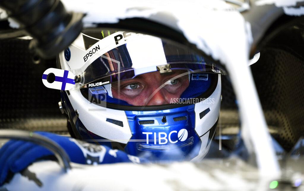 Jens Meyer Mercedes driver Valtteri Bottas of Finland prepares for the first practice session at the Hockenheimring racetrack in Hockenheim, Germany, Friday, July 26, 2019. The German Formula One Grand Prix will be held on Sunday. (AP Photo/Jens Meyer)