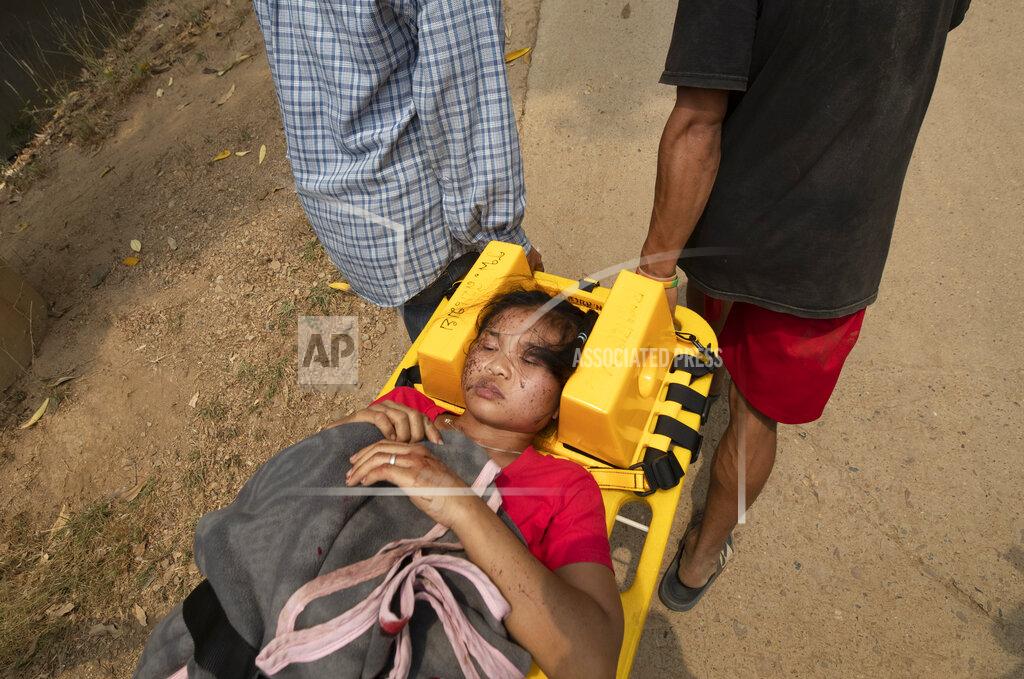 Sakchai Lalit A Karen villager from Myanmar is attended by medical workers after they crossed Salawin river on a boat, at Ban Mae Sam Laep Health Center, Mae Hong Son province, Thailand on Tuesday March 30, 2021. The weekend strikes by the Myanmar military, which sent ethnic Karen people seeking safety in Thailand, represented another escalation in the violent crackdown by Myanmar’s junta on protests of its Feb. 1 takeover.(AP Photo/Sakchai Lalit)