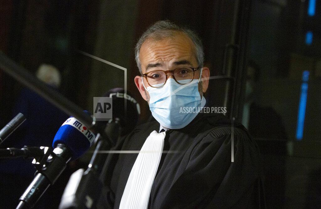 Virginia Mayo Lawyer for AstraZeneca Hakim Boularbah speaks with the media prior to a hearing, European Commission vs AstraZeneca, at the main courthouse in Brussels, Wednesday, May 26, 2021. The European Union took on vaccine producer AstraZeneca in a Brussels court on Wednesday with the urgent demand that the company needs to make an immediate delivery of COVID-19 shots the 27-nation bloc insists were already due. (AP Photo/Virginia Mayo)