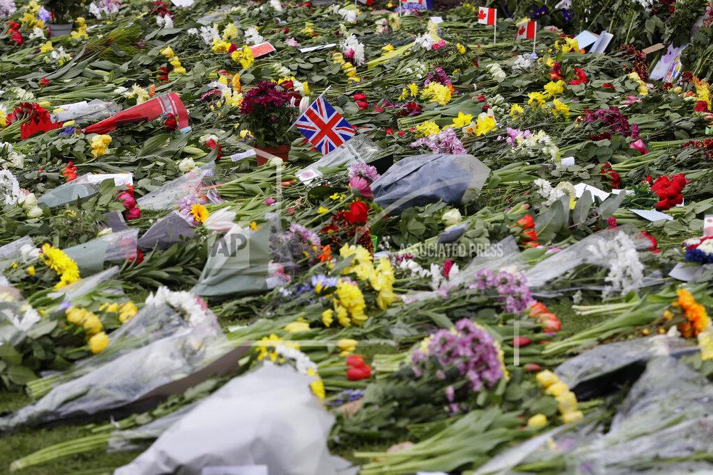 Kirsty Wigglesworth Flowers ouside Windsor Castle in Windsor, England Sunday, April 11, 2021. Britain's Prince Philip, the irascible and tough-minded husband of Queen Elizabeth II who spent more than seven decades supporting his wife in a role that mostly defined his life, died on Friday. (AP Photo/Kirsty Wigglesworth)