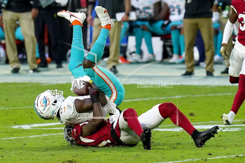 Ross D. Franklin Arizona Cardinals cornerback Patrick Peterson takes Miami Dolphins wide receiver DeVante Parker, top, during the second half of an NFL football game, Sunday, Nov. 8, 2020, in Glendale, Ariz. (AP Photo/Ross D. Franklin)