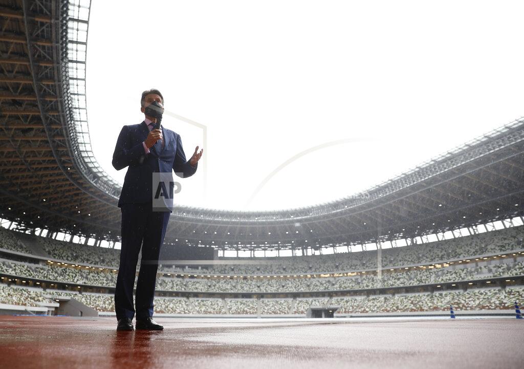 Issei Kato World Athletics President Sebastian Coe wearing a protective face mask speaks to media as he inspects at the National Stadium, the main stadium of Tokyo 2020 Olympics and Paralympics, in Tokyo Thursday, Oct. 8, 2020. (Issei Kato/Pool Photo via AP)