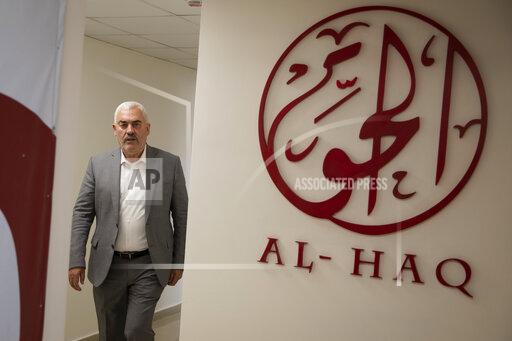 Shawan Jabarin, director of the al-Haq human rights group, at the organization's offices in the West Bank city of Ramallah, Saturday, Oct. 23, 2021. Israel on Friday, Oct. 22, declared six prominent Palestinian human rights groups to be terrorist organizations, saying they were secretly linked to a left-wing militant movement. It was not immediately clear what the distinction would mean for the groups, most of which also protest rights violations by the Western-backed Palestinian Authority. (AP Photo/Majdi Mohammed)