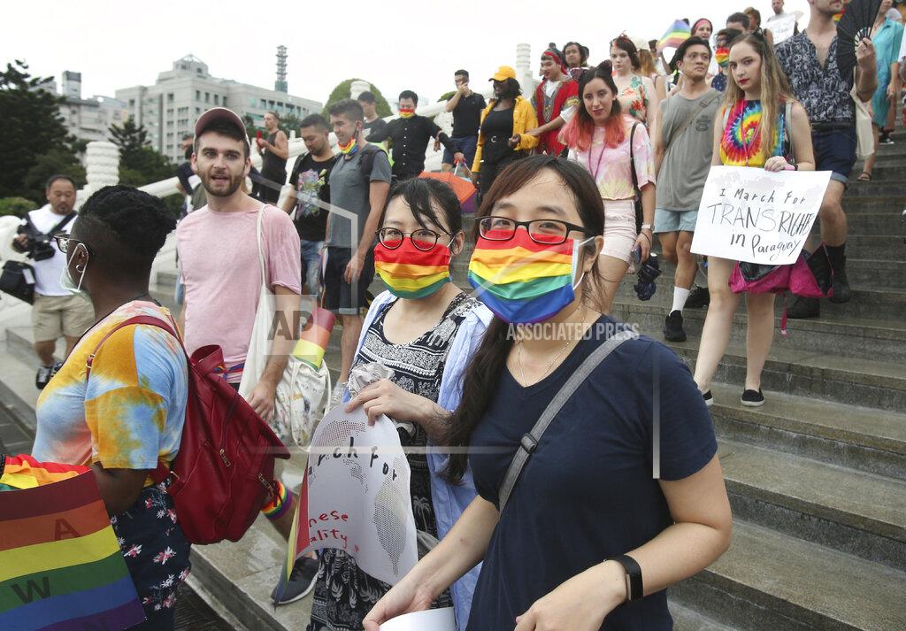 Chiang Ying-Ying Participants march during the "Taiwan Pride March for the World!" at Liberty Square at the CKS Memorial Hall in Taipei, Taiwan, Sunday, June 28, 2020. This year marks the first Gay Pride march in Chicago 1970, and due to the COVID-19 lockdown, Taiwan is one of the very few countries to host the world's only physical Gay Pride. (AP Photo/Chiang Ying-ying)