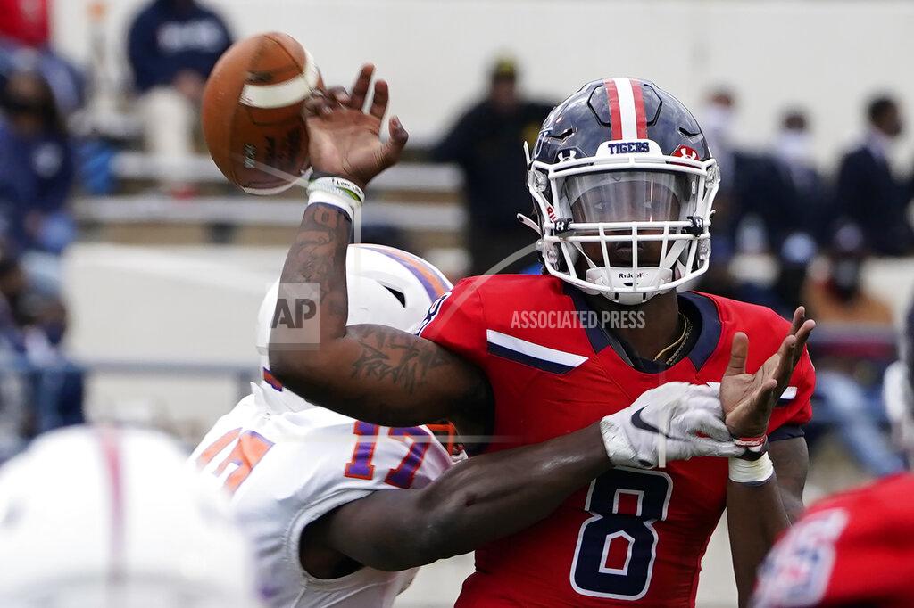 Rogelio V. Solis Jackson State quarterback Quincy Casey (8) has the football knocked from his hand as he attempts to pass by Edward Waters linebacker Derrick Nicholson (17) during the second half of an NCAA college football game in Jackson, Miss., Sunday, Feb. 21, 2021. (AP Photo/Rogelio V. Solis)