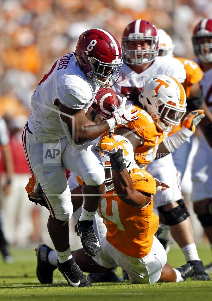 Wade Payne Alabama running back Josh Jacobs (8) runs for yardage as he's hit by Tennessee linebacker Quart'e Sapp (14) in the first half of an NCAA college football game Saturday, Oct. 20, 2018, in Knoxville, Tenn. (AP Photo/Wade Payne)
