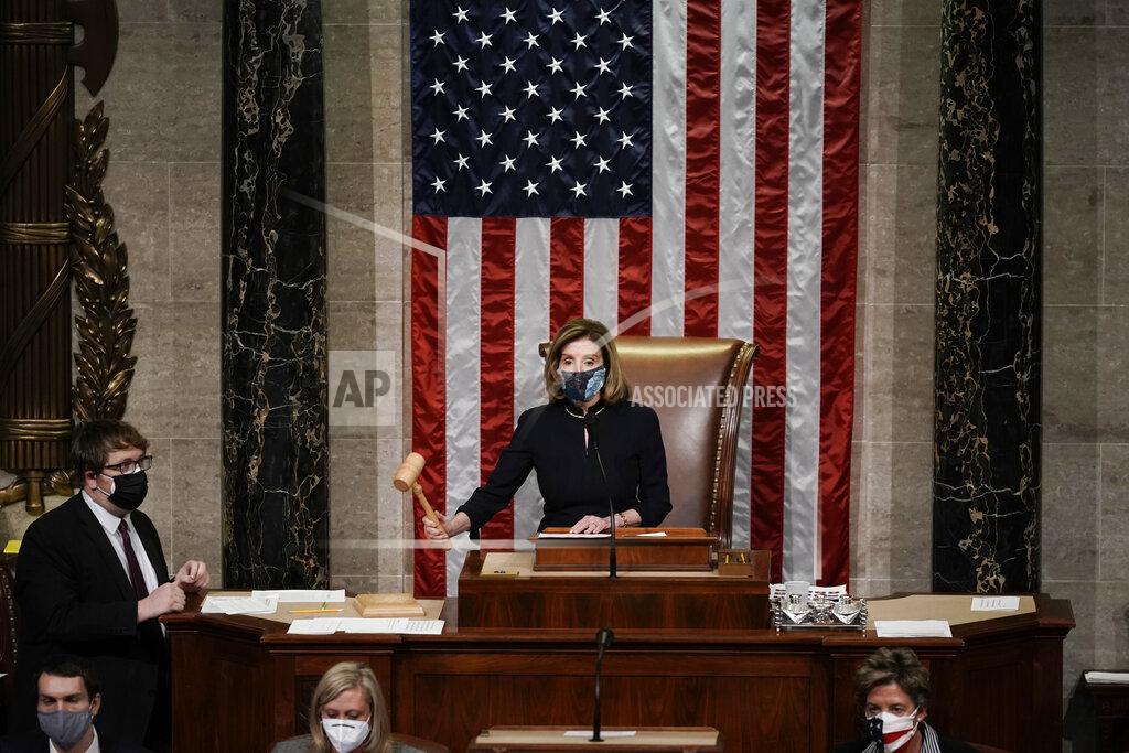 J. Scott Applewhite Speaker of the House Nancy Pelosi, D-Calif., leads the final vote of the impeachment of President Donald Trump, for his role in inciting an angry mob to storm the Congress last week, at the Capitol in Washington, Wednesday, Jan. 13, 2021. (AP Photo/J. Scott Applewhite)