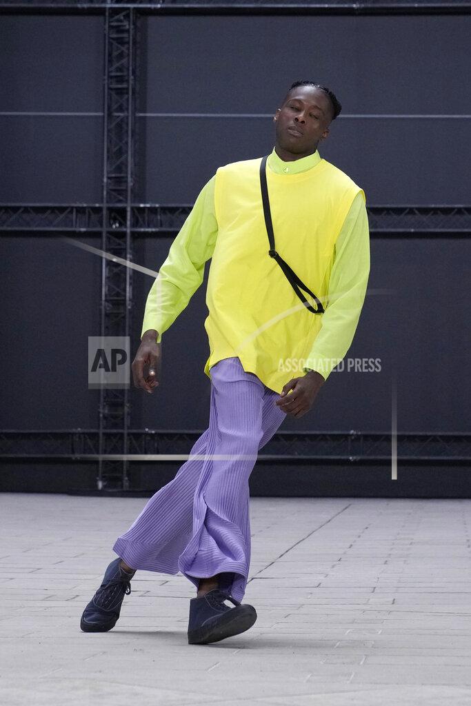 Francois Mori A model wears a creation as part of Issey Miyake Homme Plisse men's Spring Summer 2023 collection presented in Paris, France, Thursday, June 23, 2022. (AP Photo/Francois Mori)