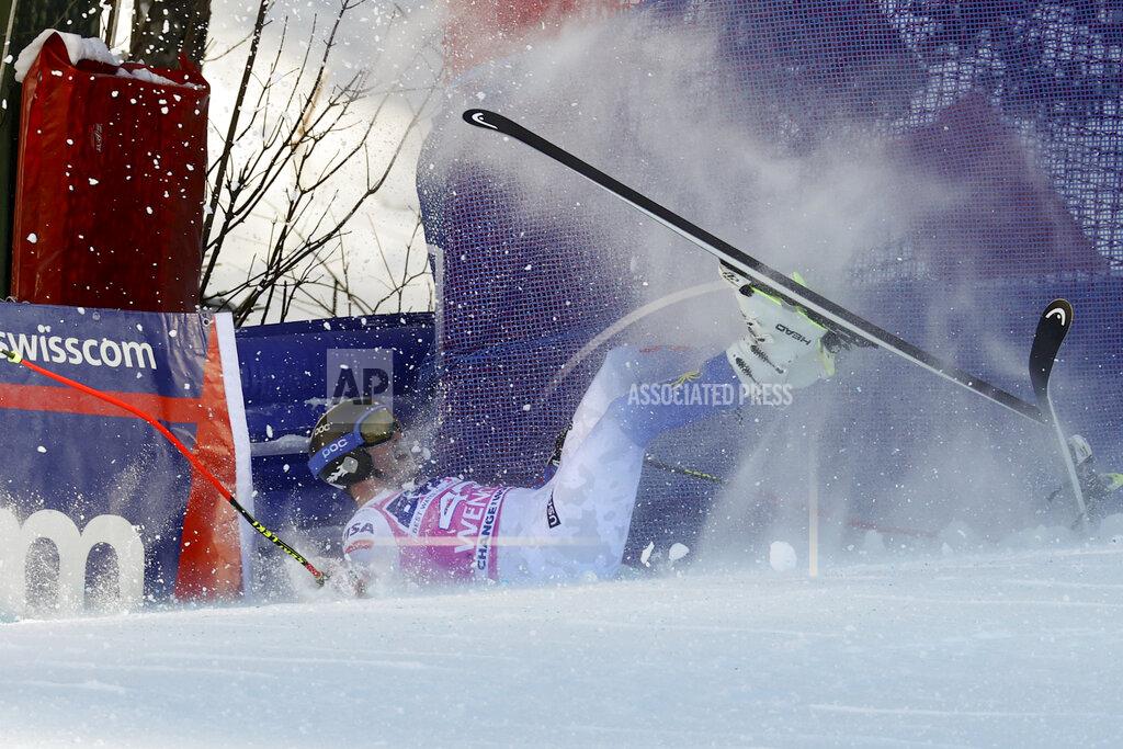 United States' Jared Goldberg crashes in the finish area of an alpine ski, men's World Cup super G, in Wengen, Switzerland, Thursday, Jan. 13, 2022. (AP Photo/Luciano Bisi)