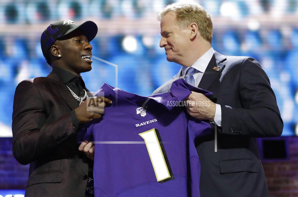 Mark Humphrey Oklahoma wide receiver Marquise Brown poses with NFL Commissioner Roger Goodell after the Baltimore Ravens Brown selected in the first round at the NFL football draft, Thursday, April 25, 2019, in Nashville, Tenn. (AP Photo/Mark Humphrey)
