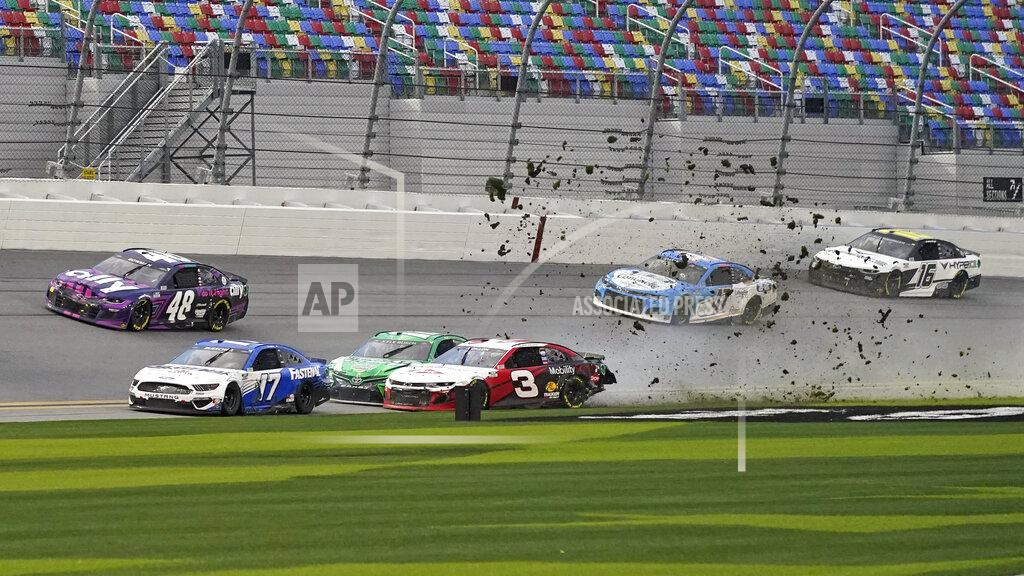 John Raoux Austin Dillon (3) and Kyle Busch, center left, crash heading down the front stretch as Chris Buescher (17), Alex Bowman (48), Ricky Stenhouse Jr. (47) and AJ Allmendinger (16) make moves to avoid the crash during NASCAR Cup Series road course auto race at Daytona International Speedway, Sunday, Feb. 21, 2021, in Daytona Beach, Fla. (AP Photo/John Raoux)
