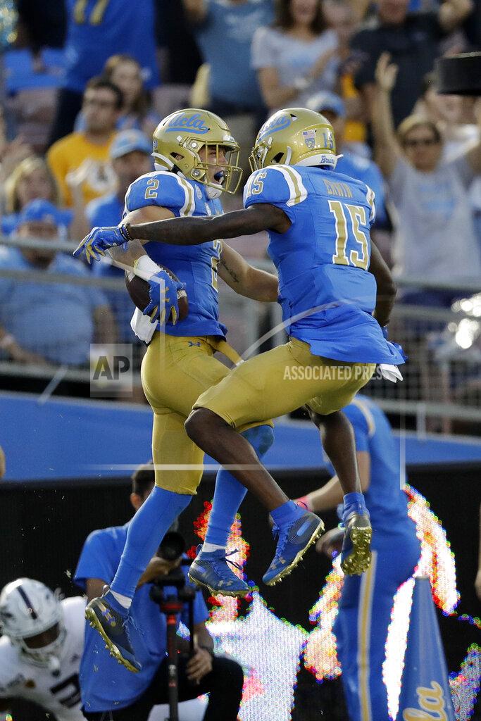 Marcio Jose Sanchez UCLA wide receiver Kyle Philips (2) celebrates his touchdown catch with wide receiver Jaylen Erwin (15) during the first half of an NCAA college football game against Arizona State Saturday, Oct. 26, 2019, in Pasadena, Calif. (AP Photo/Marcio Jose Sanchez)