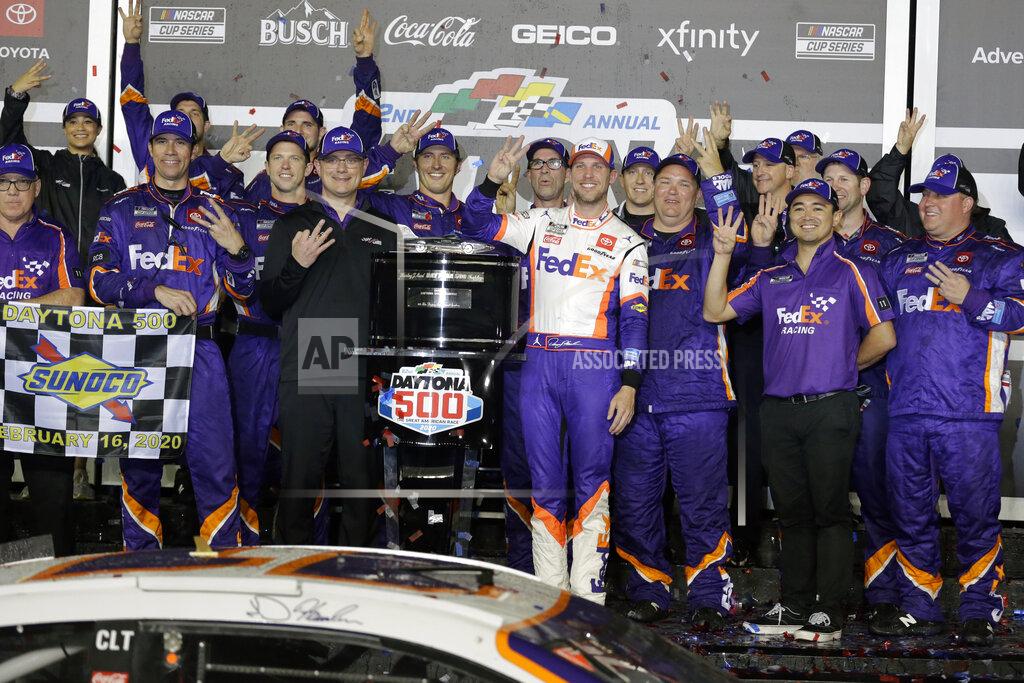 Terry Renna Denny Hamlin, center, celebrates with crew members after winning the NASCAR Daytona 500 auto race at Daytona International Speedway, Monday, Feb. 17, 2020, in Daytona Beach, Fla. (AP Photo/Terry Renna)