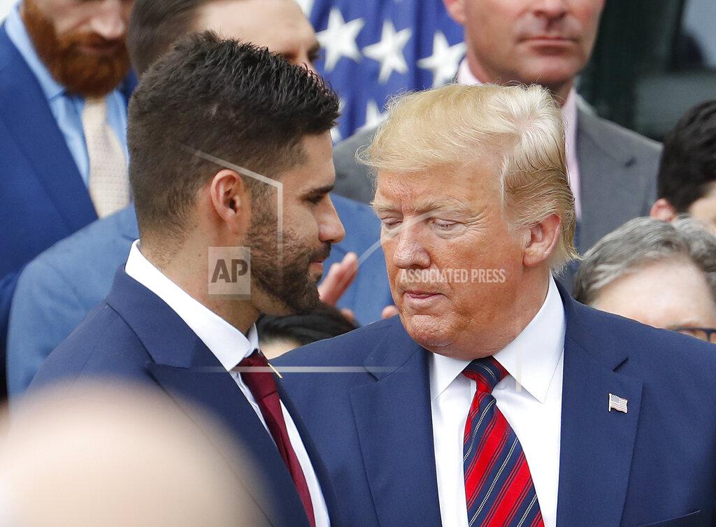 Pablo Martinez Monsivais J.D. Martinez, left, walks past President Donald Trump, right, during a ceremony on the South Lawn of the White House in Washington, Thursday, May 9, 2019, where Trump honored the 2018 World Series Baseball Champion Boston Red Sox.(AP Photo/Pablo Martinez Monsivais)