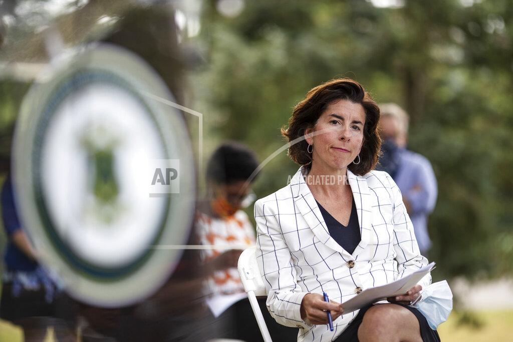 David Goldman FILE - In this June 22 2020 file photo Rhode Island Gov. Gina Raimondo sits during a news conference in Providence, R.I., Raimondo, on Friday, Sept. 25, blamed outbreaks at two colleges for a surge of virus cases that boosted the state's infection rate high enough to put it on the list of places whose residents are required to quarantine when traveling to New York, New Jersey and Connecticut. (AP Photo/David Goldman)