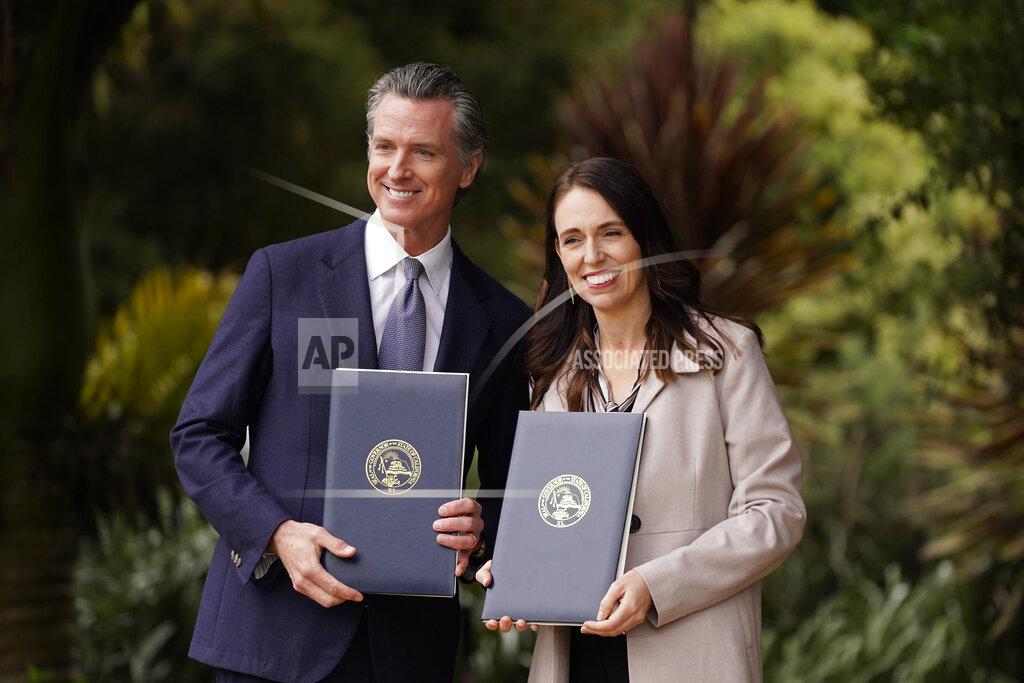 Eric Risberg California Gov. Gavin Newsom and New Zealand Prime Minister Jacinda Ardern pose with agreements they signed at the San Francisco Botanical Garden in San Francisco, Friday, May 27, 2022. Gov. Newsom met with Ardern in Golden Gate Park "to establish a new international partnership tackling climate change." (AP Photo/Eric Risberg)