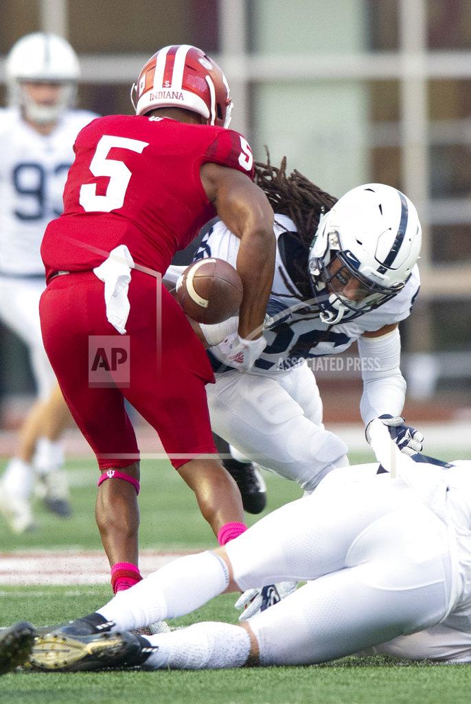 Doug Mcschooler Penn State safety Jonathan Sutherland (26) knocks the ball away from Indiana wide receiver J-Shun Harris II (5) setting up a fumble recovery by Penn State during a punt return in the second half of an NCAA college football game Saturday, Oct. 20, 2018, in Bloomington, Ind. Penn State won 33-28. (AP Photo/Doug McSchooler)