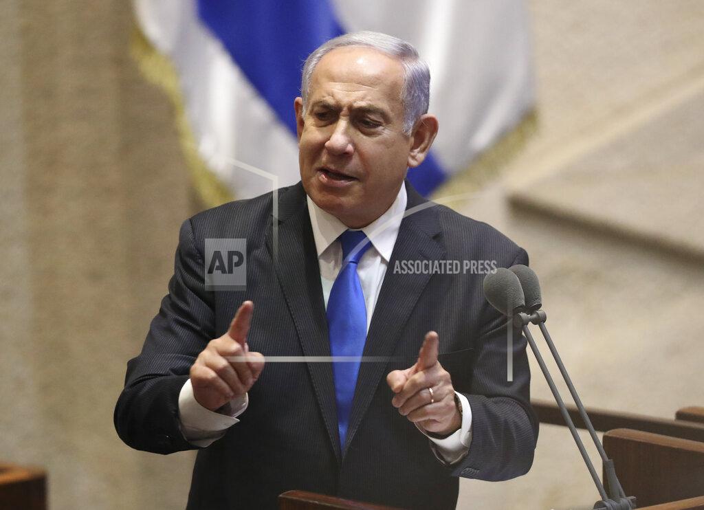Ariel Schalit Israel's outgoing prime minister Benjamin Netanyahu speaks during a Knesset session in Jerusalem Sunday, June 13, 2021. Bennett is expected later Sunday to be sworn in as the country's new prime minister, ending Prime Minister Benjamin Netanyahu's 12-year rule. (AP Photo/Ariel Schali22