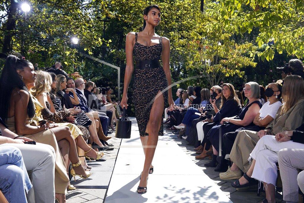 Richard Drew The Michael Kors Spring/Summer 2022 collection is modeled during Fashion Week in New York, Friday, Sept. 10, 2021. (AP Photo/Richard Drew)