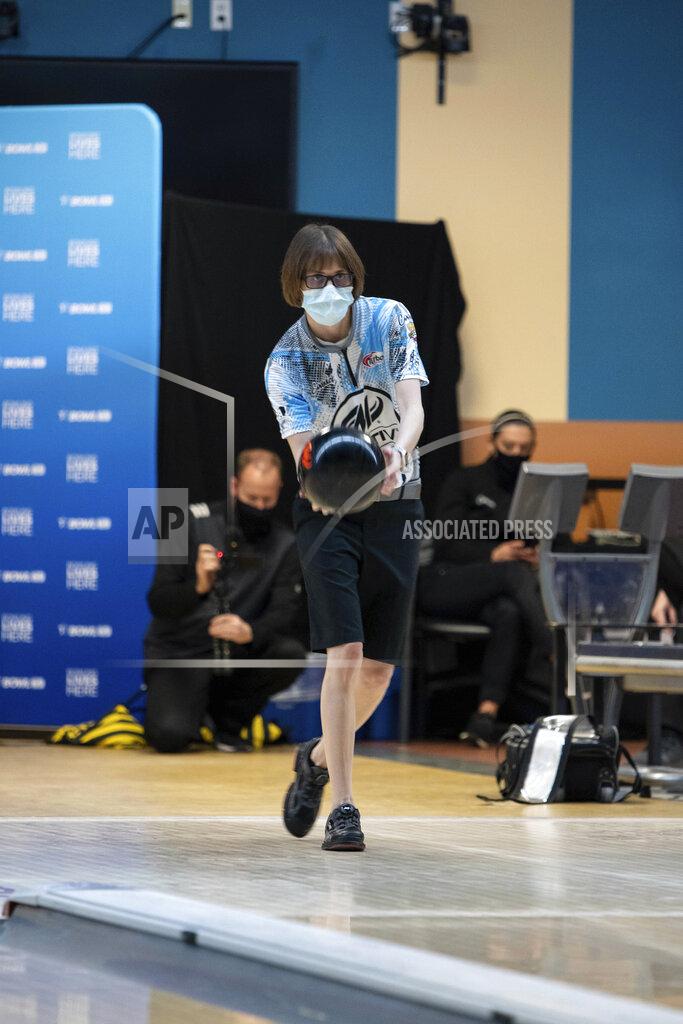 Uncredited Critical care nurse and professional bowler Erin McCarthy competes at the 2021 PWBA Kickoff Classic Series in Arlington, Texas, on Jan. 26, 2021. "You have to have a calm demeanor and think clearly," McCarthy says. "I think that's probably why I love doing them both equally as much." (USBC via AP)