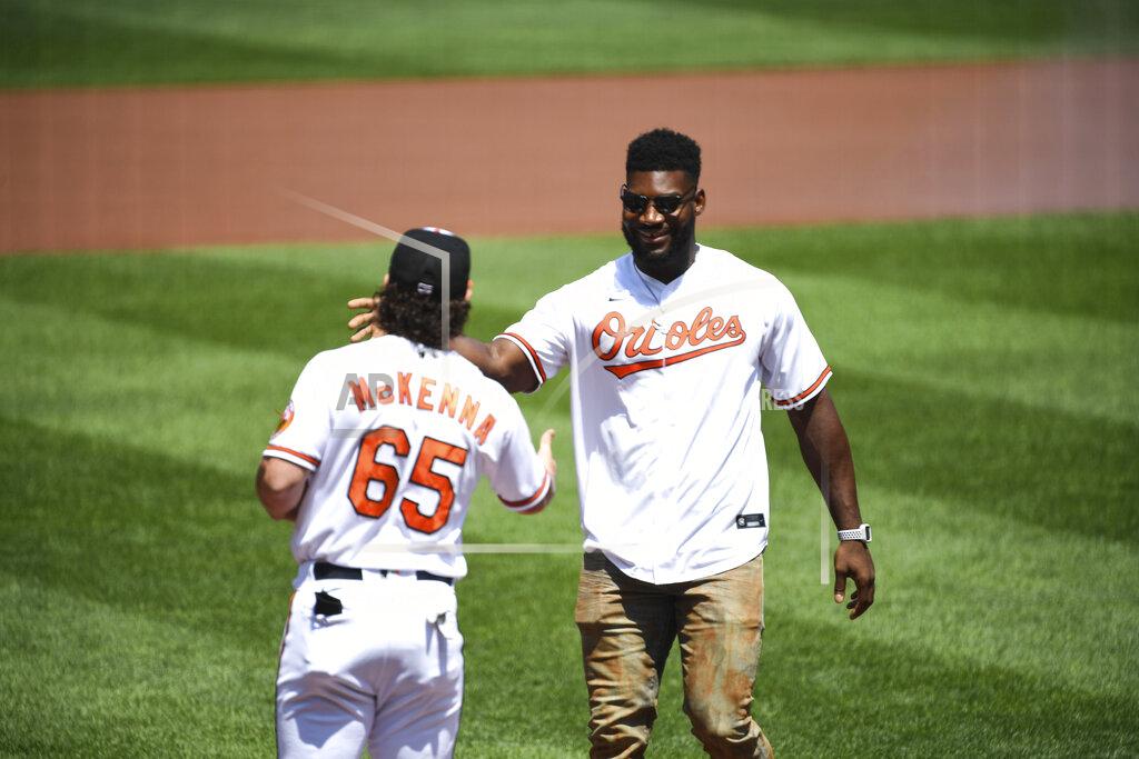Terrance Williams Baltimore Ravens' Tyus Bowser, right, is greeted by Baltimore Orioles' Ryan McKenna (65) after throwing out the ceremonial first pitch before a baseball game between the Orioles and the Tampa Bay Rays, Sunday, Aug. 8, 2021, in Baltimore. (AP Photo/Terrance Williams)