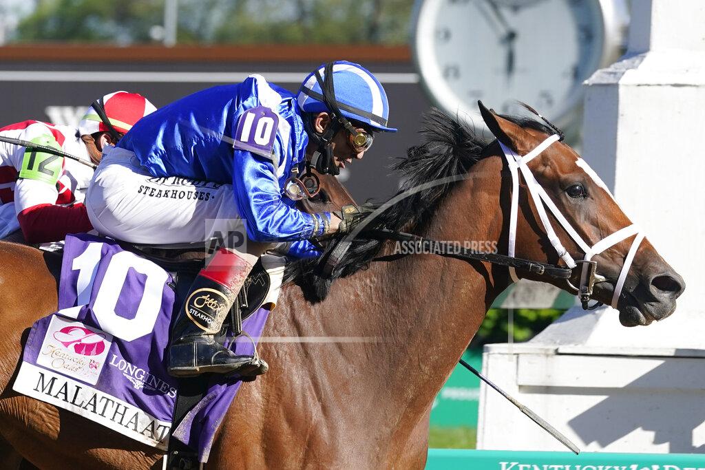 Darron Cummings John Velazquez rides Malathaat to victory during the 147th running of the Kentucky Oaks at Churchill Downs, Friday, April 30, 2021, in Louisville, Ky. (AP Photo/Darron Cummings)