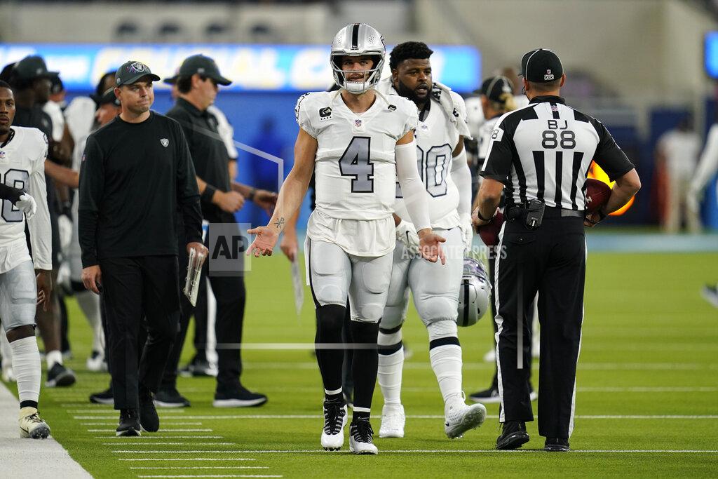 Ashley Landis Las Vegas Raiders quarterback Derek Carr (4) reacts as referees instruct players to leave the field due to a weather delay shortly before the scheduled start an NFL football game against the Los Angeles Chargers, Monday, Oct. 4, 2021, in Inglewood, Calif. (AP Photo/Ashley Landis)