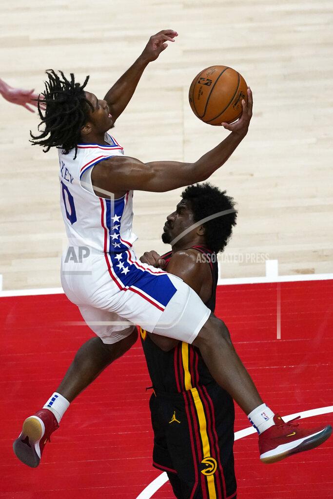 John Bazemore Philadelphia 76ers guard Tyrese Maxey (0) is fouled by Atlanta Hawks forward Solomon Hill (18) as he drives to the basket during the first half of an NBA basketball game Monday, Jan. 11, 2021, in Atlanta. (AP Photo/John Bazemore)