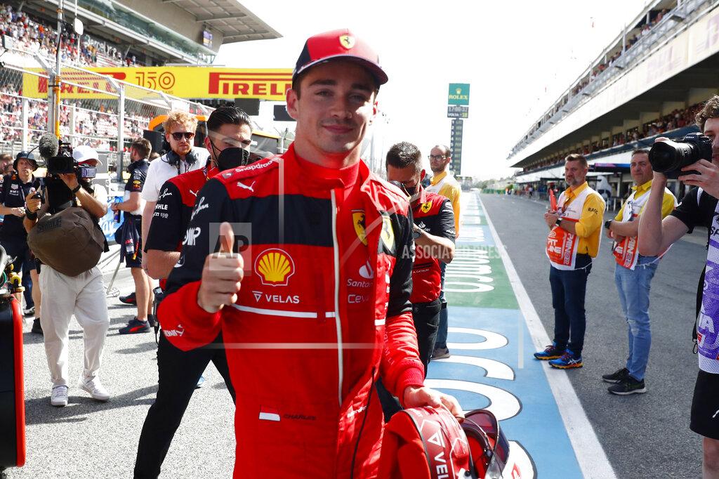 Joan Monfort Ferrari driver Charles Leclerc of Monaco thumbs up after setting the pole position in the qualifying session at the Barcelona Catalunya racetrack in Montmelo, Spain, Saturday, May 21, 2022. The Formula One race will be held on Sunday. (AP Photo/Joan Monfort)
