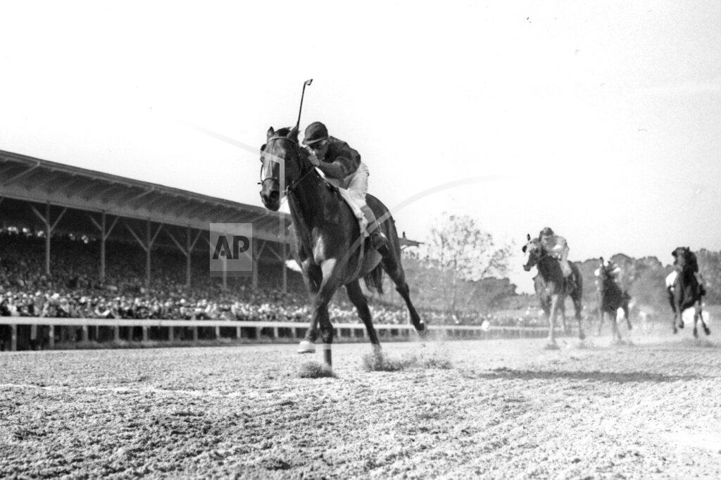 Uncredited FILE - In this June 12, 1948, file photo, Citation, jockey Eddie Arcado up, races for a win and the Triple Crown in the $100,000 added Belmont Stakes at Belmont Park race track in Elmont, N.Y. Secretariat is the early 7-2 favorite for this weekend’s virtual Kentucky Derby, an animated race pitting all 13 Triple Crown winners on the day the Derby would have been held before the coronavirus pandemic postponed it. Citation was made the 4-1 second choice. (AP Photo/File)