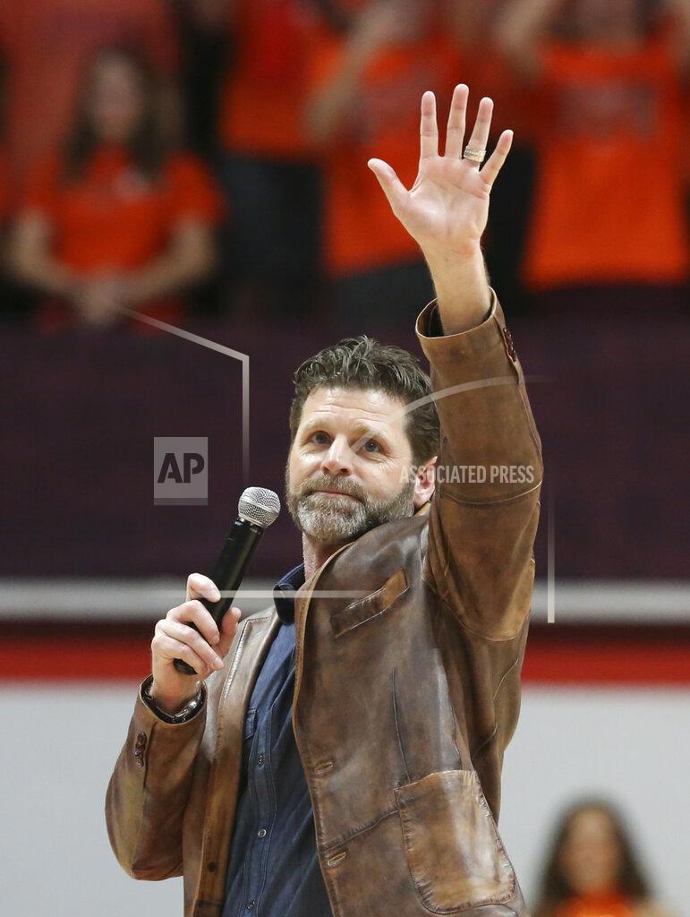 Matt Gentry New Virginia Tech Football head coach Brent Pry addresses fans in the first half of the Wake Forest Virginia Tech NCAA college basketball game in Blacksburg, Va. Saturday, Dec. 4 2021. (Matt Gentry/The Roanoke Times via AP)