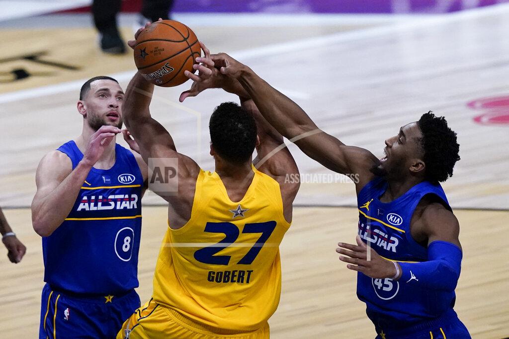 Brynn Anderson Utah Jazz guard Donovan Mitchell blocks a shot by Utah Jazz center Rudy Gobert during the second half of basketball's NBA All-Star Game in Atlanta, Sunday, March 7, 2021. (AP Photo/Brynn Anderson)